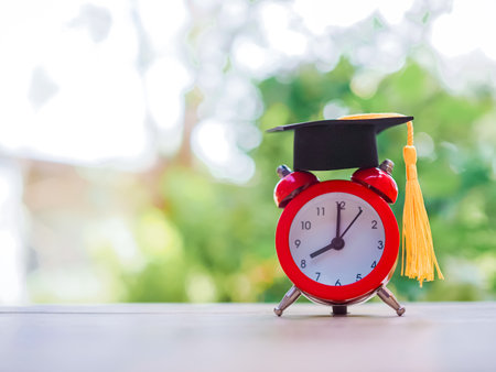 Study goals, Red alarm with graduation hat. The concept for manage time to success graduate.の写真素材