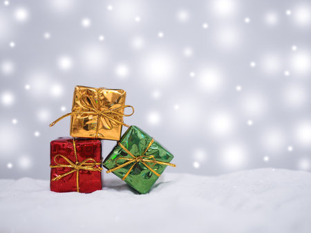Red and Green gift box with shiny light for Christmas and New Year holidays background, Winter season, falling snow, Copy space for Christmas and New Year holidays greeting card.の写真素材