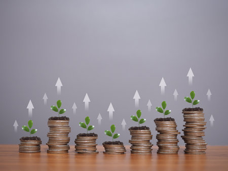 Plants growing up on stack of coins with arrow rising icons. The concept of business growth, Financial investment, Market stock, Profit return, Dividend and Business fund.の写真素材