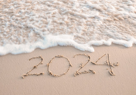 2024 year written on the beach in the sunset time. New Year 2024 concept
