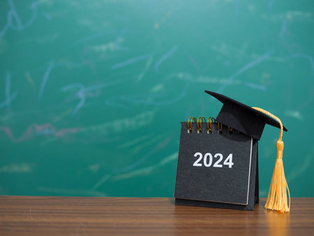 Study goals, 2024 Desk calendar with graduation hat. The concept for Resolution, Goal, Action,...