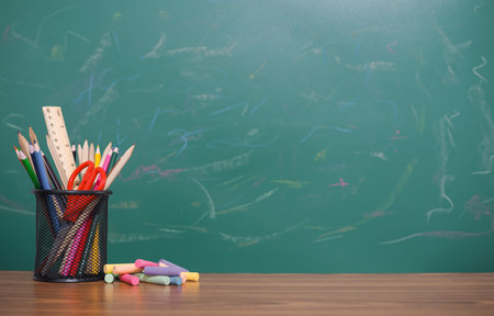 Student creative desktop with colorful stationery and multicolor chalk. Copy space for text, Back to...