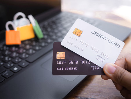 Woman hand holding credit card, Shopping bags on a laptop keyboard. The concepts about Business E-Commerce and online shopping that offers home deliveryの写真素材