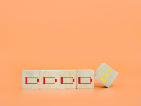 Wooden block with status of battery icons.