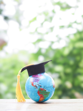 Earth globe with graduation hat. Copy space for text, Back to school, Education conceptの写真素材