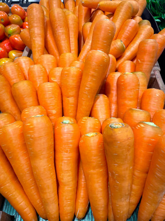 Fresh organic Carrots in basket for selling in the supermarket.の写真素材