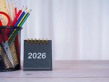 Creative desk with 2026 calendar and colorful stationery. Copy space for text, Office workspace...