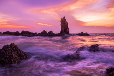 View of bigs stone in the sunset times, Sea waves breaking on rocks with splashes