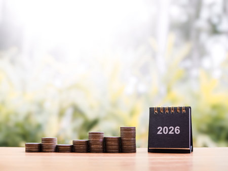 2026 desk calendar and stack of coins. The concept of business growth, Financial investment, Market...