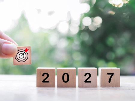 Wooden blocks with the number 2027 with nature background. The concept of Goal achievement , target,...