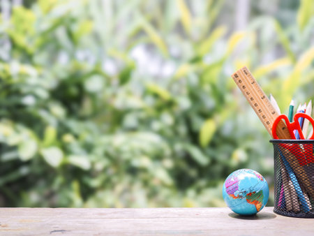 Student creative desktop. Earth globe and colorful stationery. Copy space for text, Back to school, Education conceptの写真素材