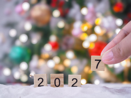 Close up of number 2027 and Christmas decorations with Christmas light background.