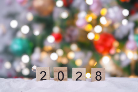 Close up of number 2028 and Christmas decorations with Christmas light background.の写真素材