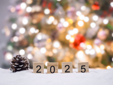 Close up of number 2025 and Christmas decorations with Christmas light background.の写真素材