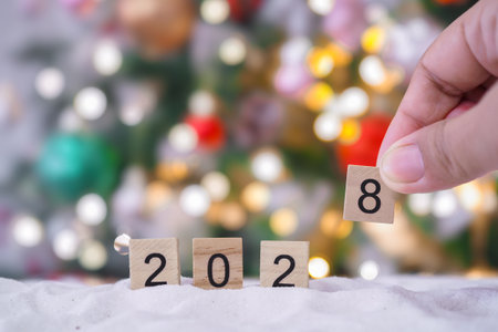 Close up of number 2028 and Christmas decorations with Christmas light background.の写真素材