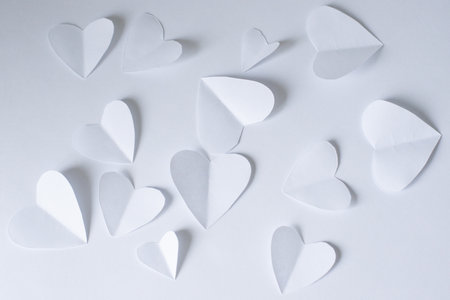 White paper hearts on a white background. Flat lay, top view.の写真素材