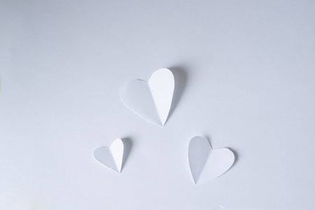 White paper hearts on a white background. Valentine's day concept.の写真素材