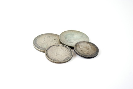 silver old coins on a white backgroundの写真素材