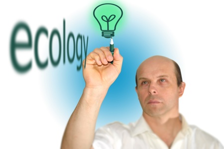 man drawing a light bulb on a white backgroundの写真素材