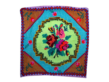 head pillow embroidered with colored threads on a white background