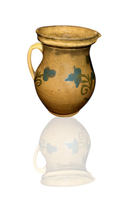 vessel of clay and reflection on white backgroundの写真素材