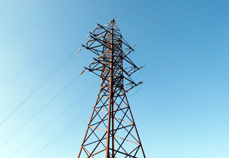 iron pole for electricity supply with wires and blue sky