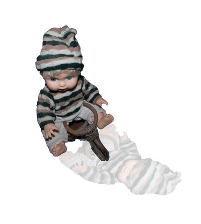 Doll sitting on the bike on a white backgroundの写真素材