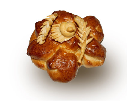 baked bun with pieces of wheat and birds