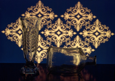 glass vase and bottle in the background of patternsの写真素材