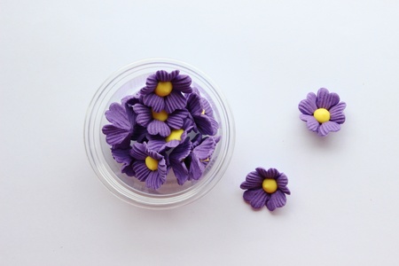 Small purple flower made from sugar for decorate the dessertの写真素材