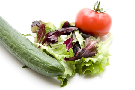 Salad leaves with cucumber and tomatoの写真素材