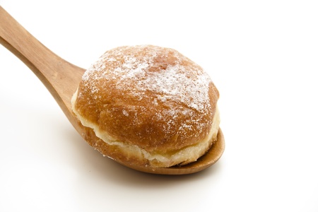 Donuts on wooden spoonの写真素材