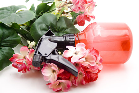 Spray bottle and geranium