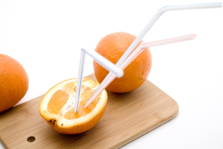 Orange with drinking strawの写真素材