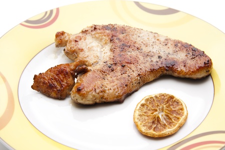 Turkey breast with slice of orangeの写真素材