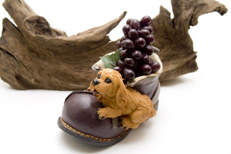 Stone shoe with wine grapesの写真素材