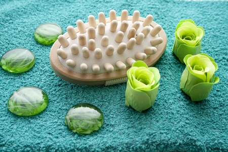 Massage brush on terry cloth towelの写真素材