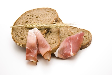 Rye bread with ham and earの写真素材