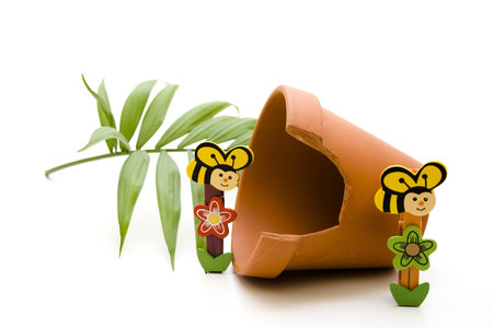 Wooden bees with flowerpotの写真素材