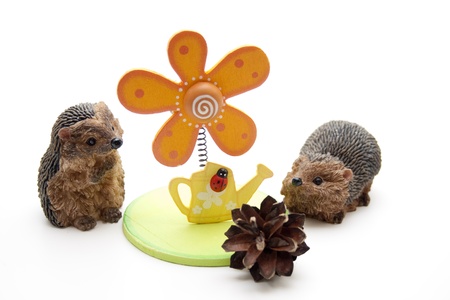 Wooden flower with hedgehog pair of onesの写真素材