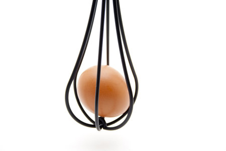 Whisks with eggの写真素材