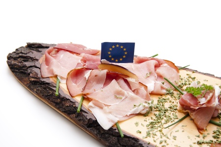 Ham on wooden plate with flagの写真素材