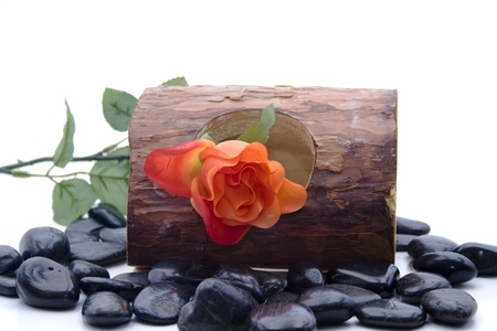 Stones with wood and roseの写真素材