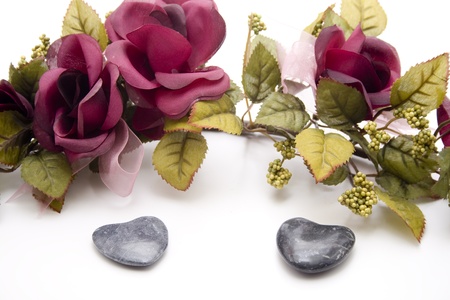 Stone heart with rose garlandの写真素材