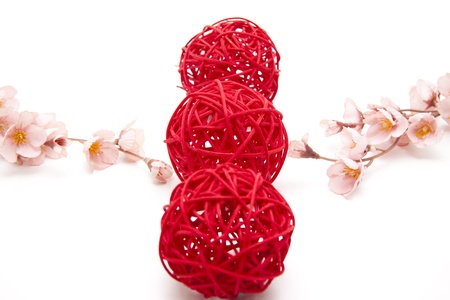 Straw balls with flower branchの写真素材