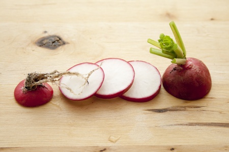 Radishes on wooden boardの写真素材