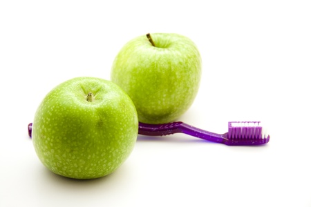 Apples with toothbrushの写真素材