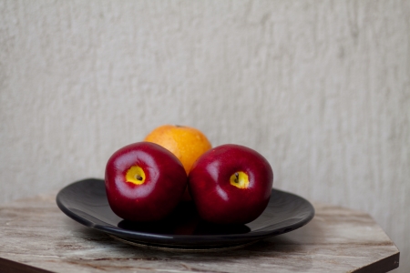 Red apples with orangeの写真素材