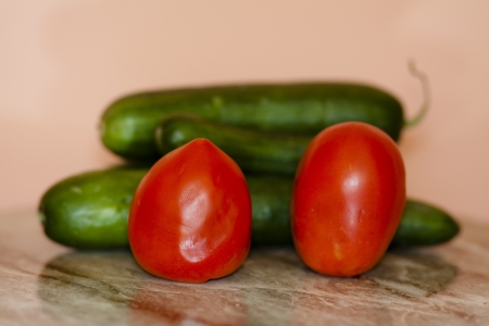 Tomatoes and cucumbersの写真素材