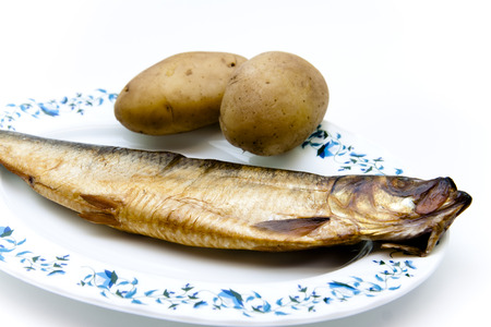 Herring smoked with potatoes on plateの写真素材